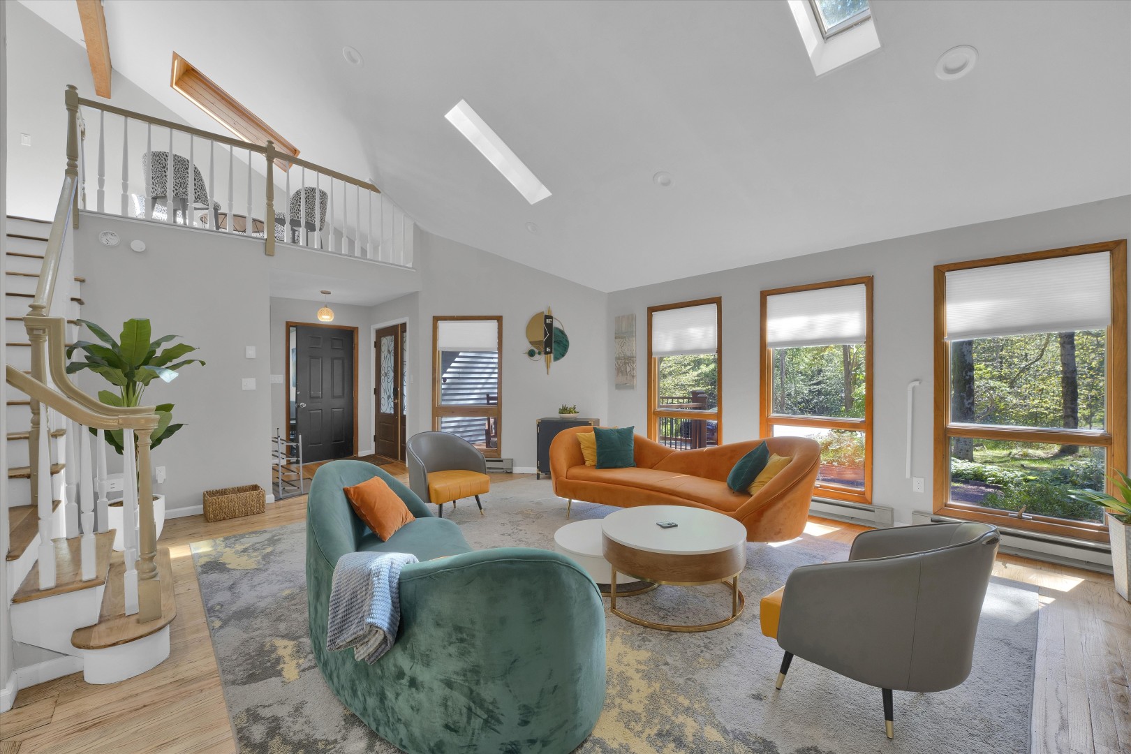 Stretch out in the vibrant living area, where vaulted ceilings and ample natural light invite you to unwind and relax.