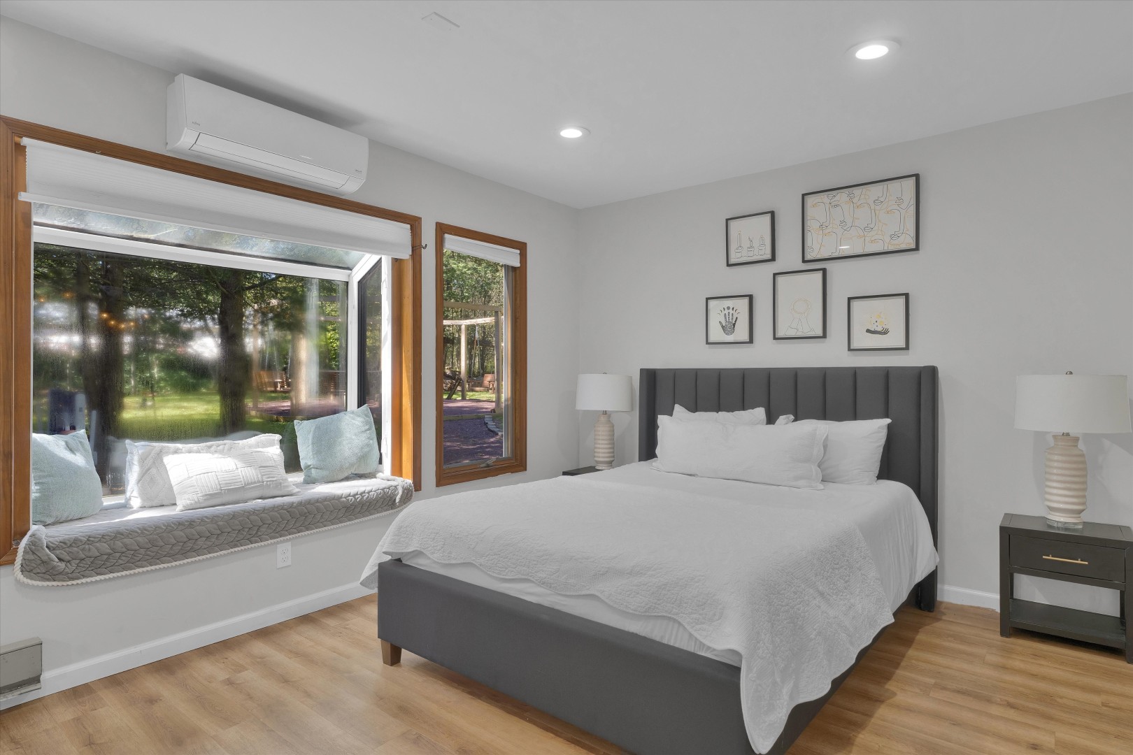 Enjoy plush bedding and peaceful views - the cozy window nook is the perfect spot to relax with a book.