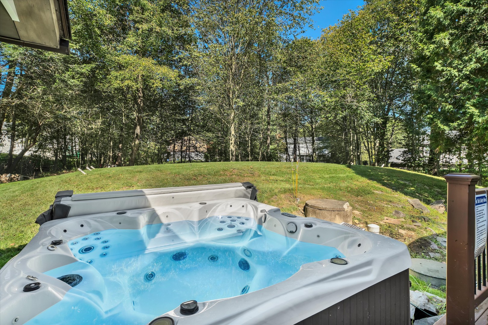 Slip into the warm, bubbling hot tub and let your worries melt away as you take in the tranquil natural surroundings.