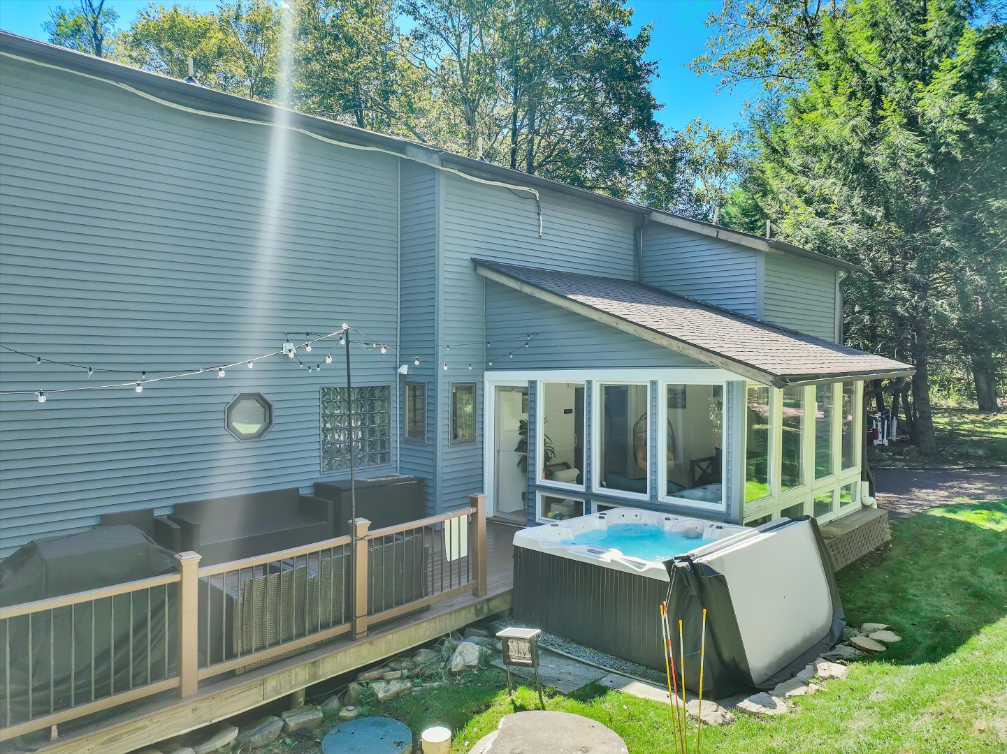 Soak in the warm hot tub or relax on the cozy patio furniture, surrounded by the peaceful woods.