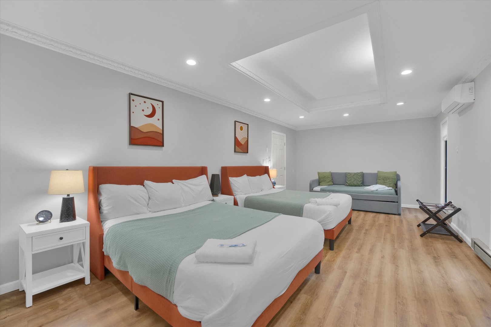Recharge after a day in the Poconos in this bright bedroom, outfitted with two queen beds and a sofa bed.