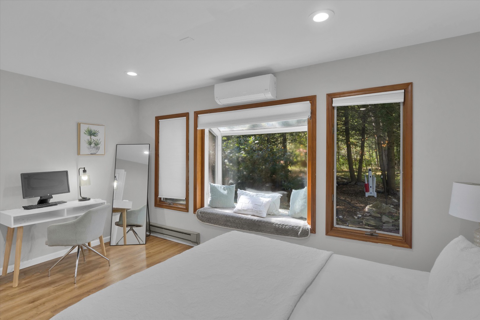 Catch up on work at the sunlit workstation, then relax by the window in this quiet bedroom retreat.