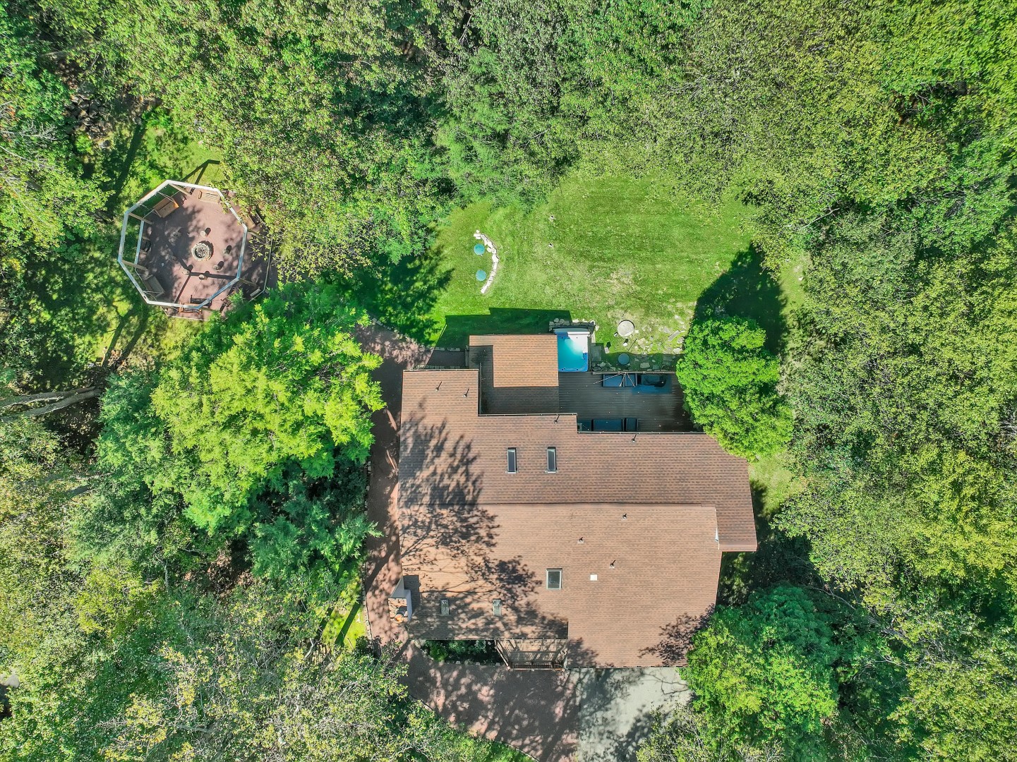 Discover your secluded retreat, nestled among the tranquil trees, enjoy evenings by the fire pit or soak in the hot tub under the open sky.