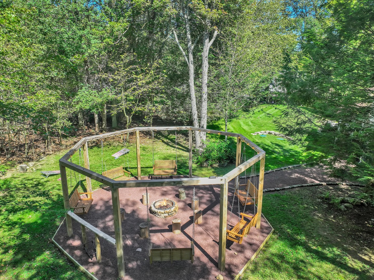 Kick back on the wooden swings, warm up by the fire, and take in the forest views.