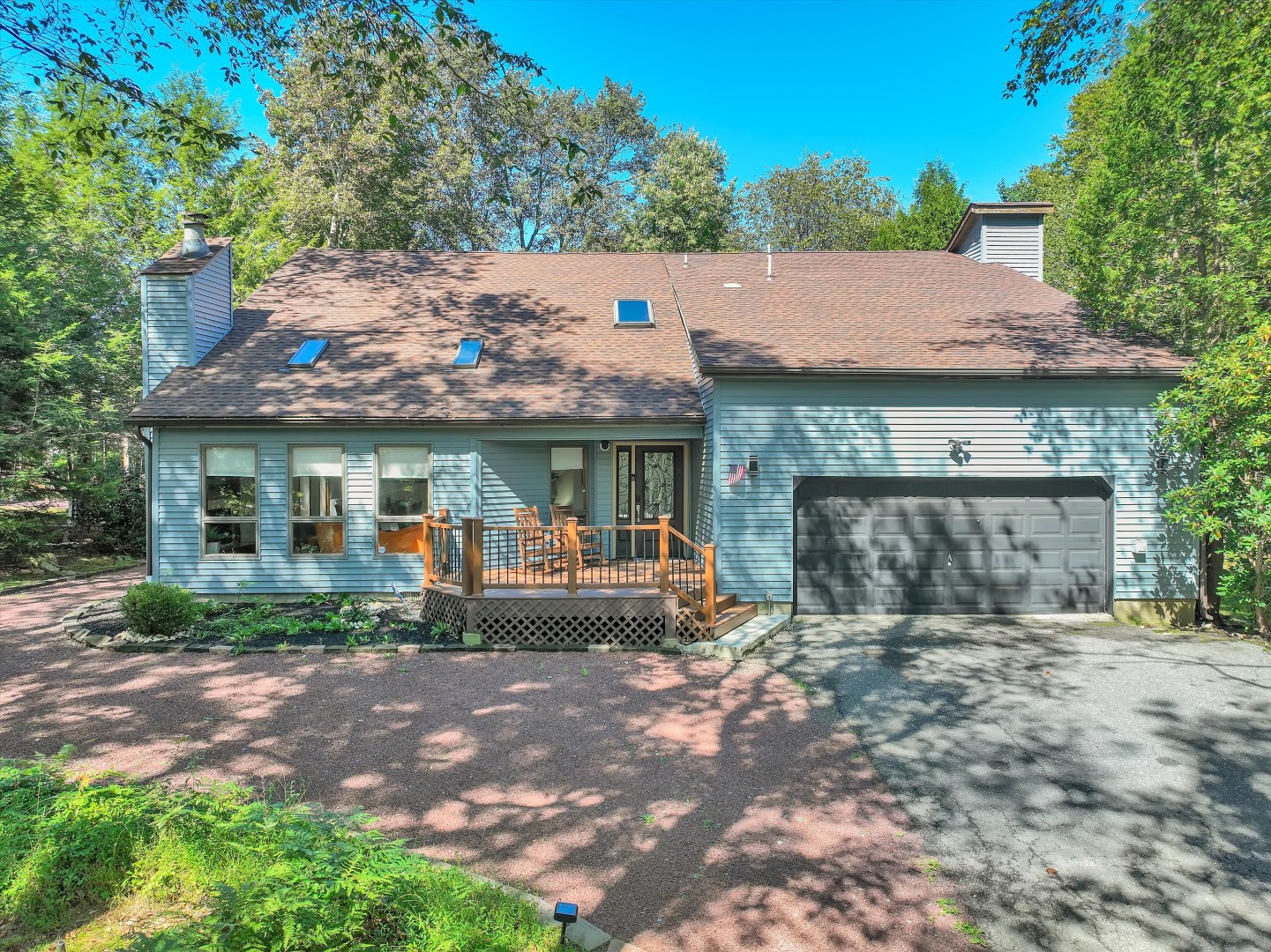 Take in the peaceful surroundings from the private deck, with nature and mature trees right outside your door.