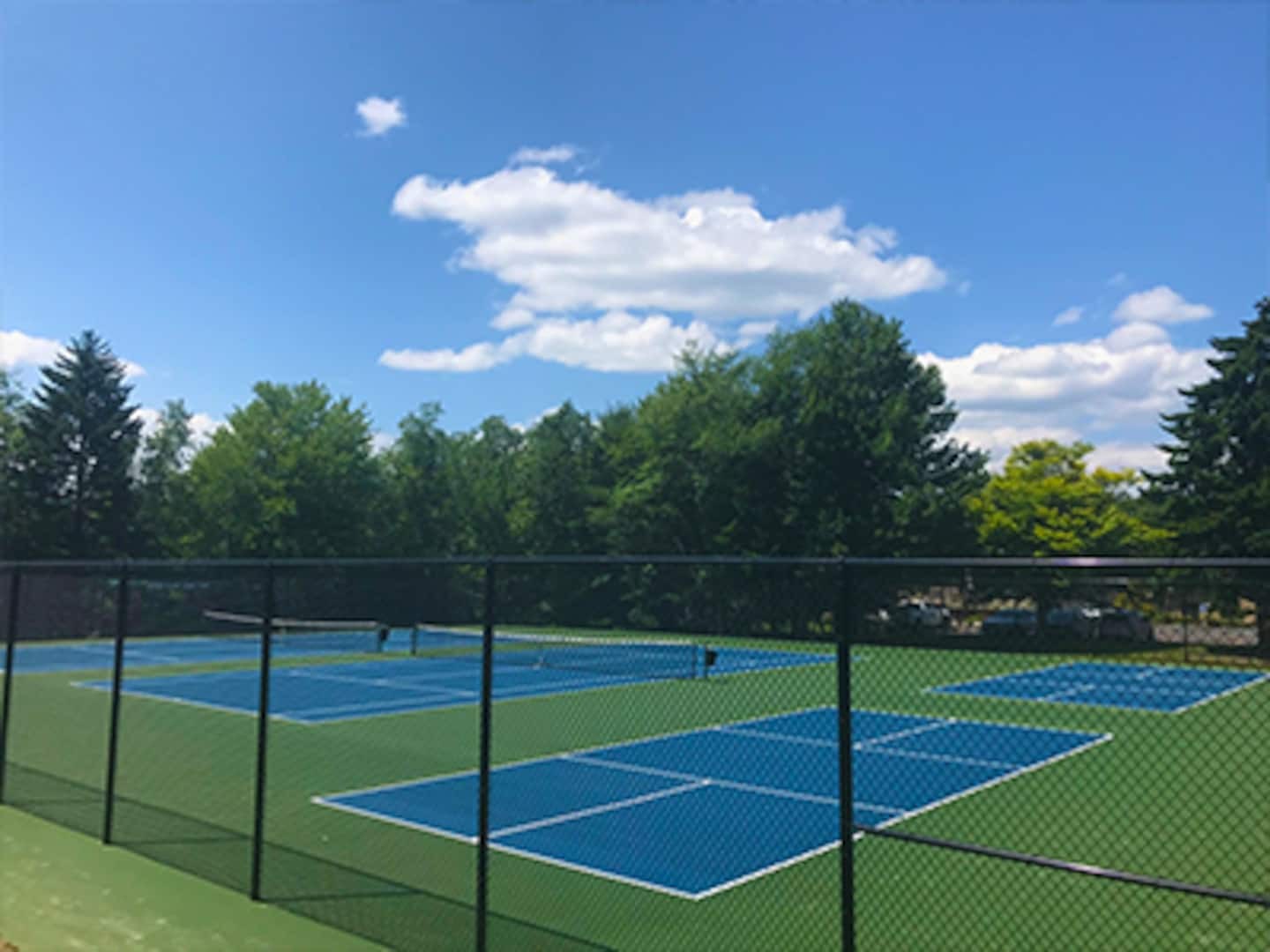 Enjoy community sports access—challenge your friends to a friendly game of tennis or pickleball.