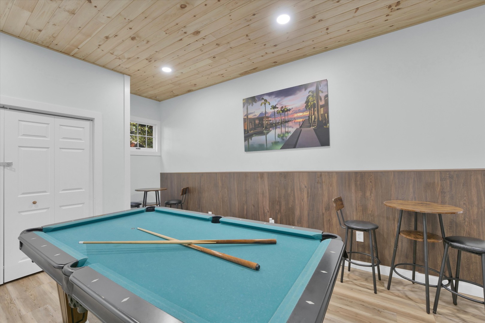 Rack 'em up for game night in this wood-paneled lounge outfitted for friendly competition.